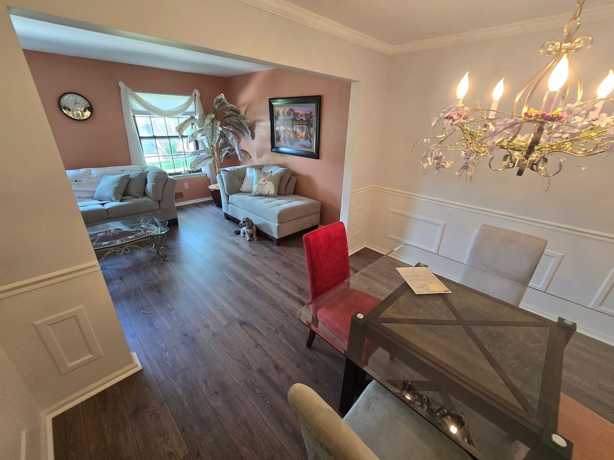 Dark Duravana plank flooring in a dining room with a chandelier
