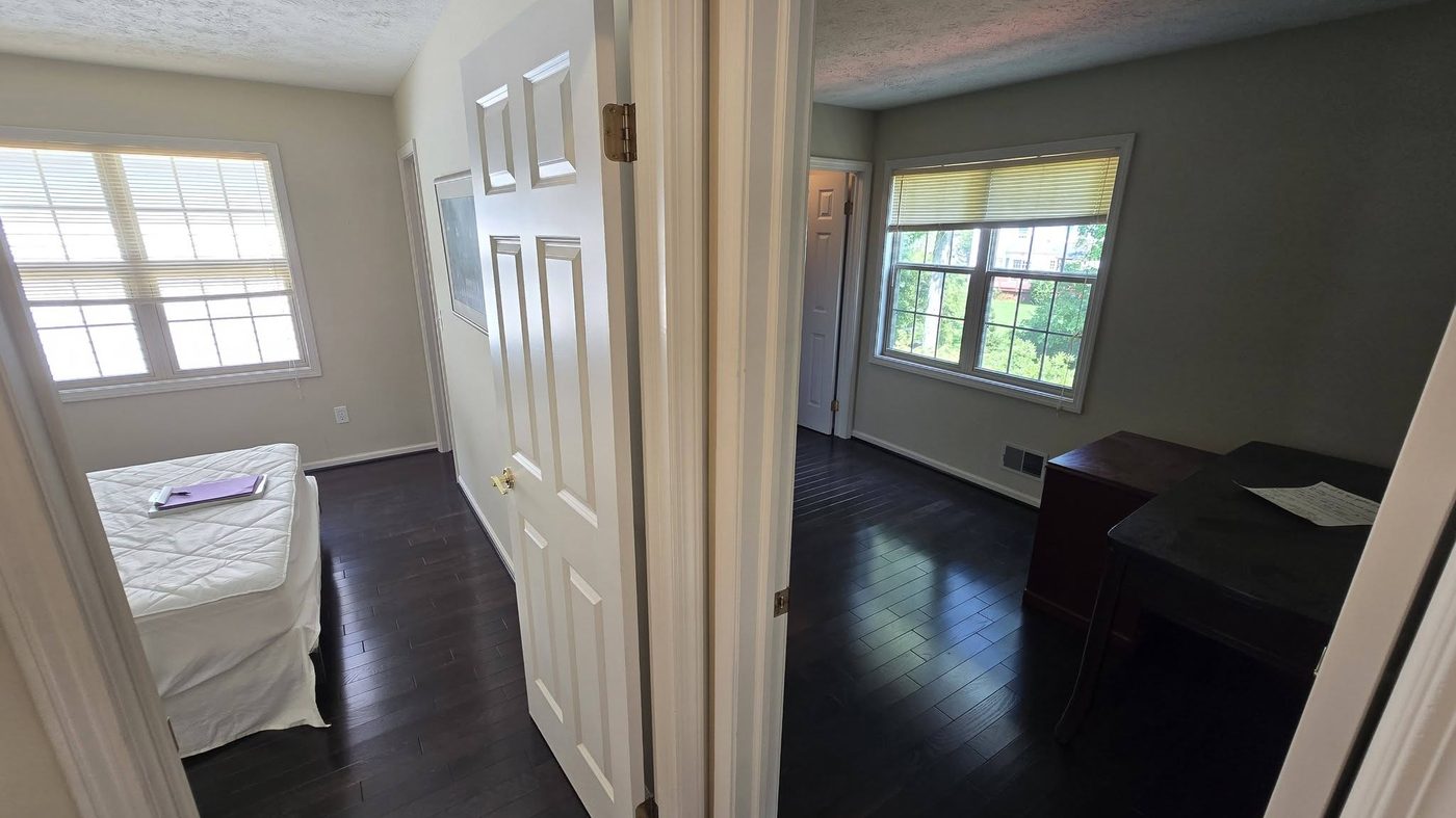 Espresso stained oak hardwood running through a hallway after carpet removal