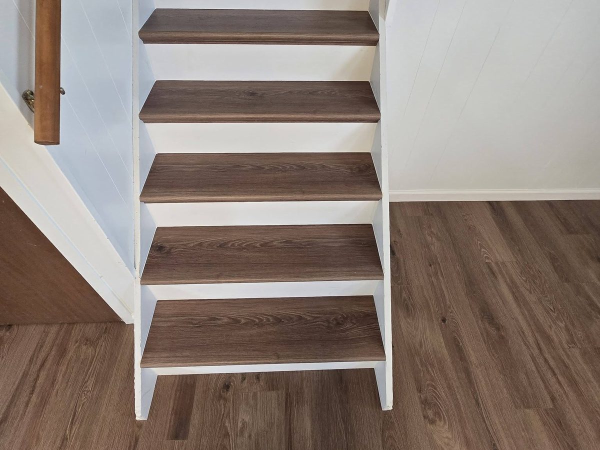 Finished staircase with wood treads and white risers