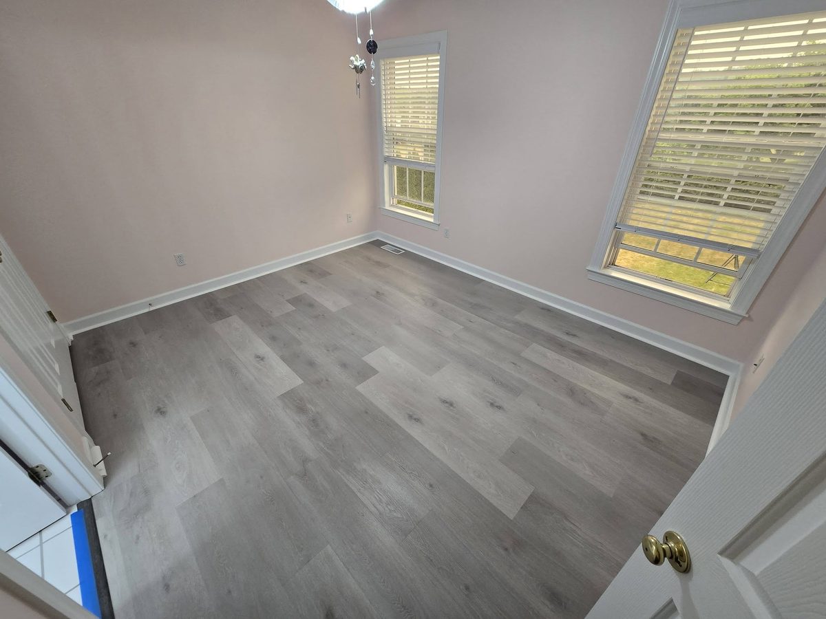 Light grey vinyl plank flooring in a bright room