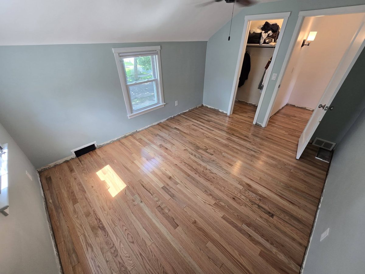 Natural red oak hardwood in a room with sloped ceiling