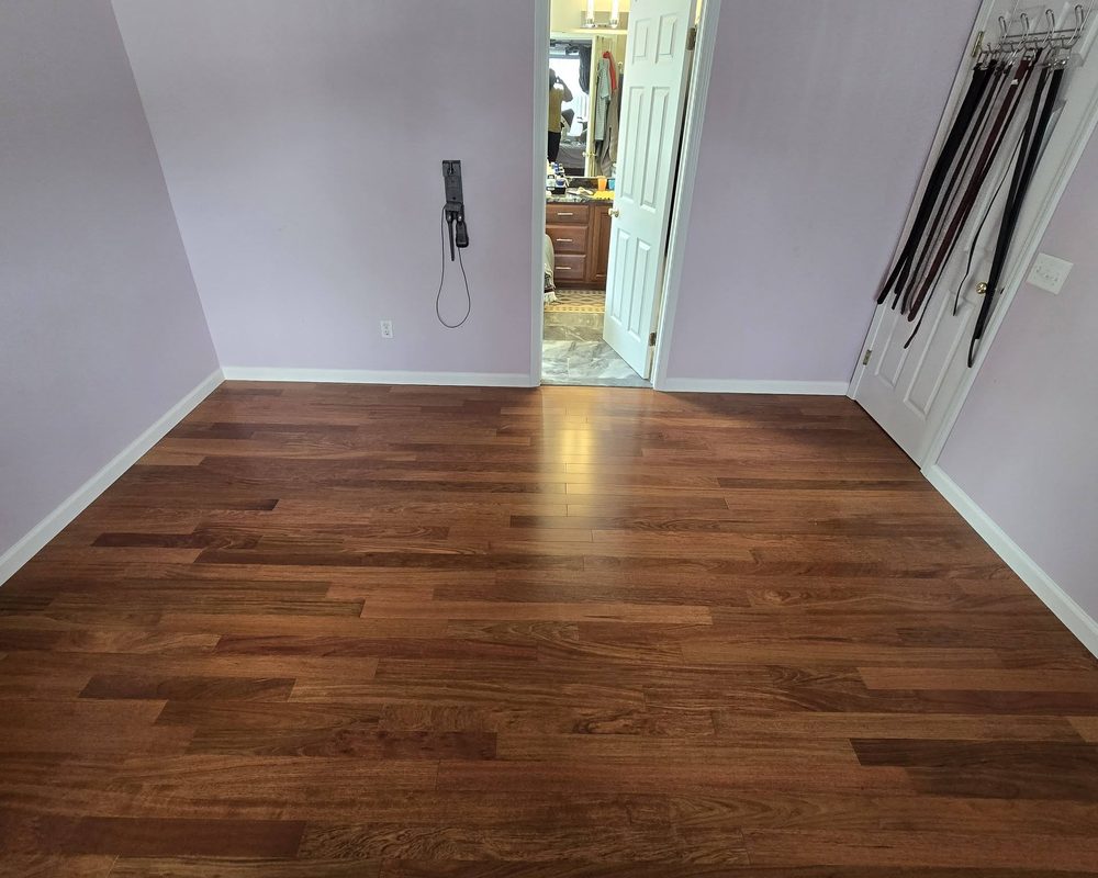 Finished hardwood floor in a bedroom